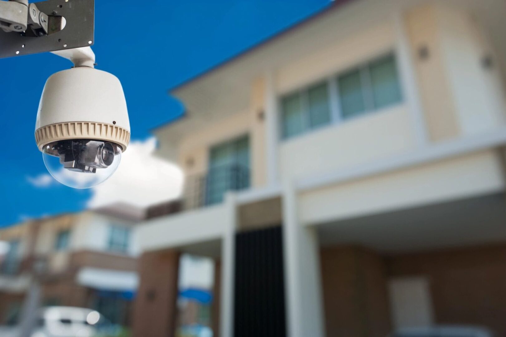 A close up of a camera outside of a house